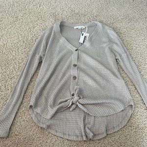 CUTE waffle knit long sleeves with tie at bottom! Size S